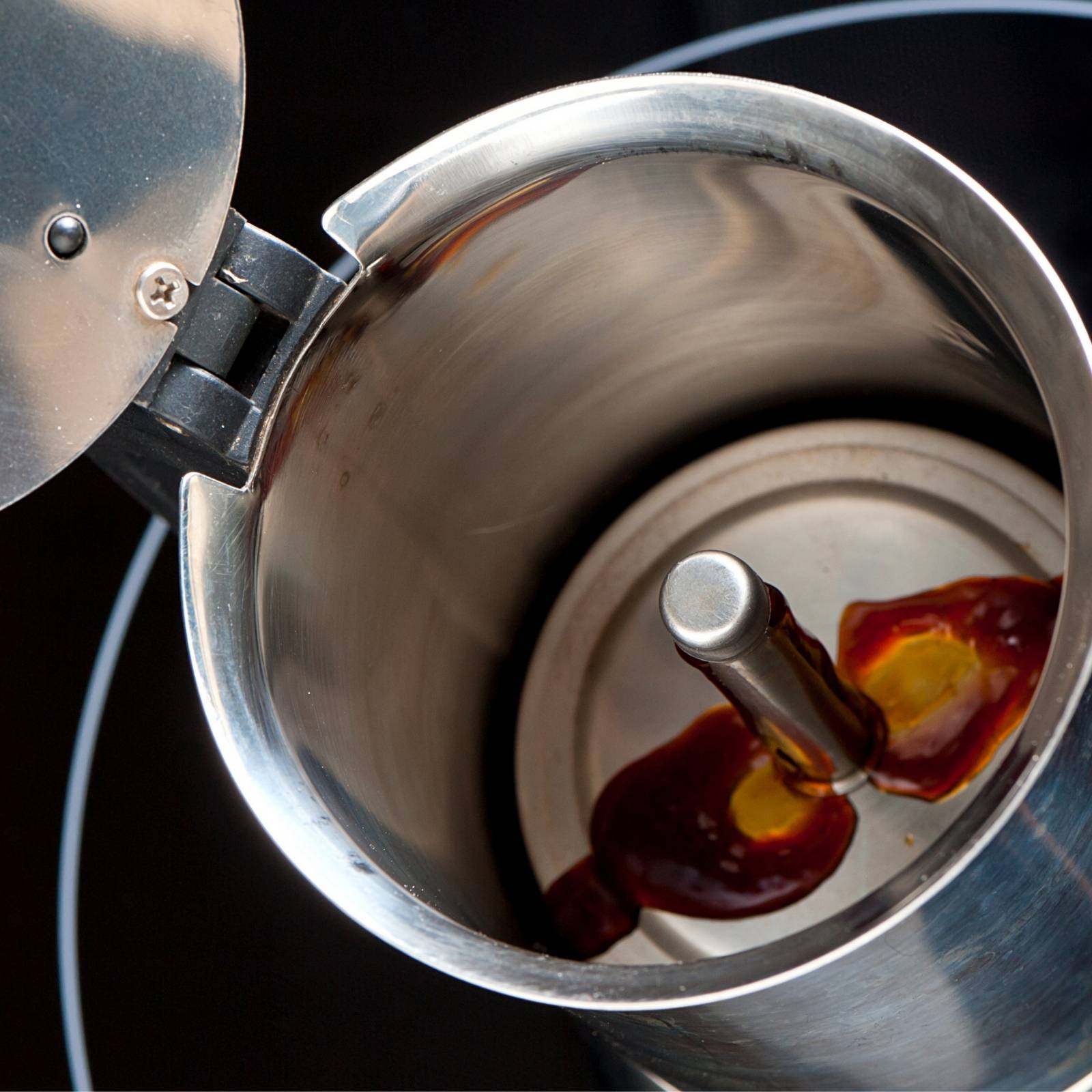 Coffee beginning to brew into the top chamber of a Moka Pot (Stove top coffee maker)