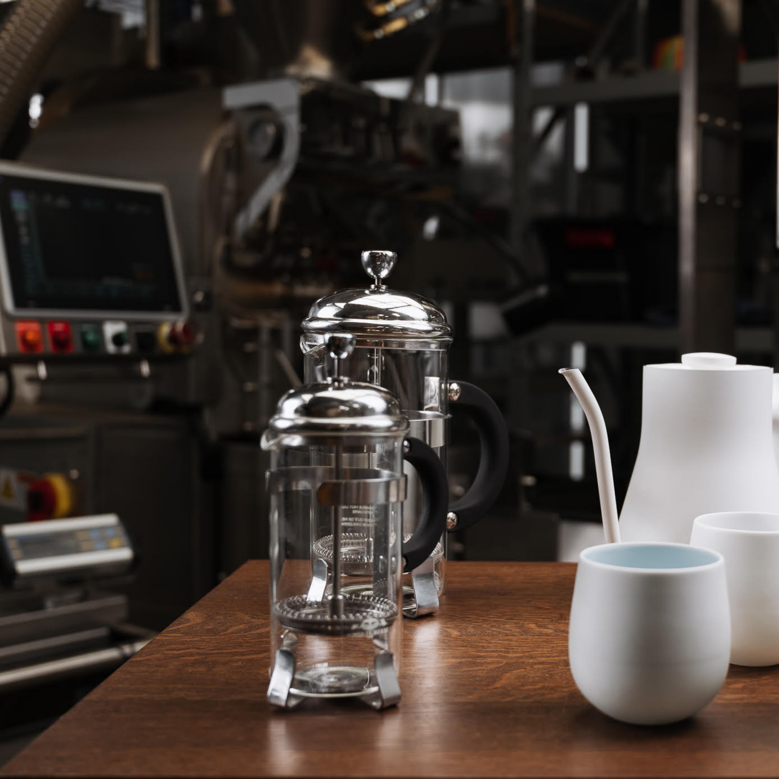 Plungers (French Press) with Kettle in front of Coffee Roaster