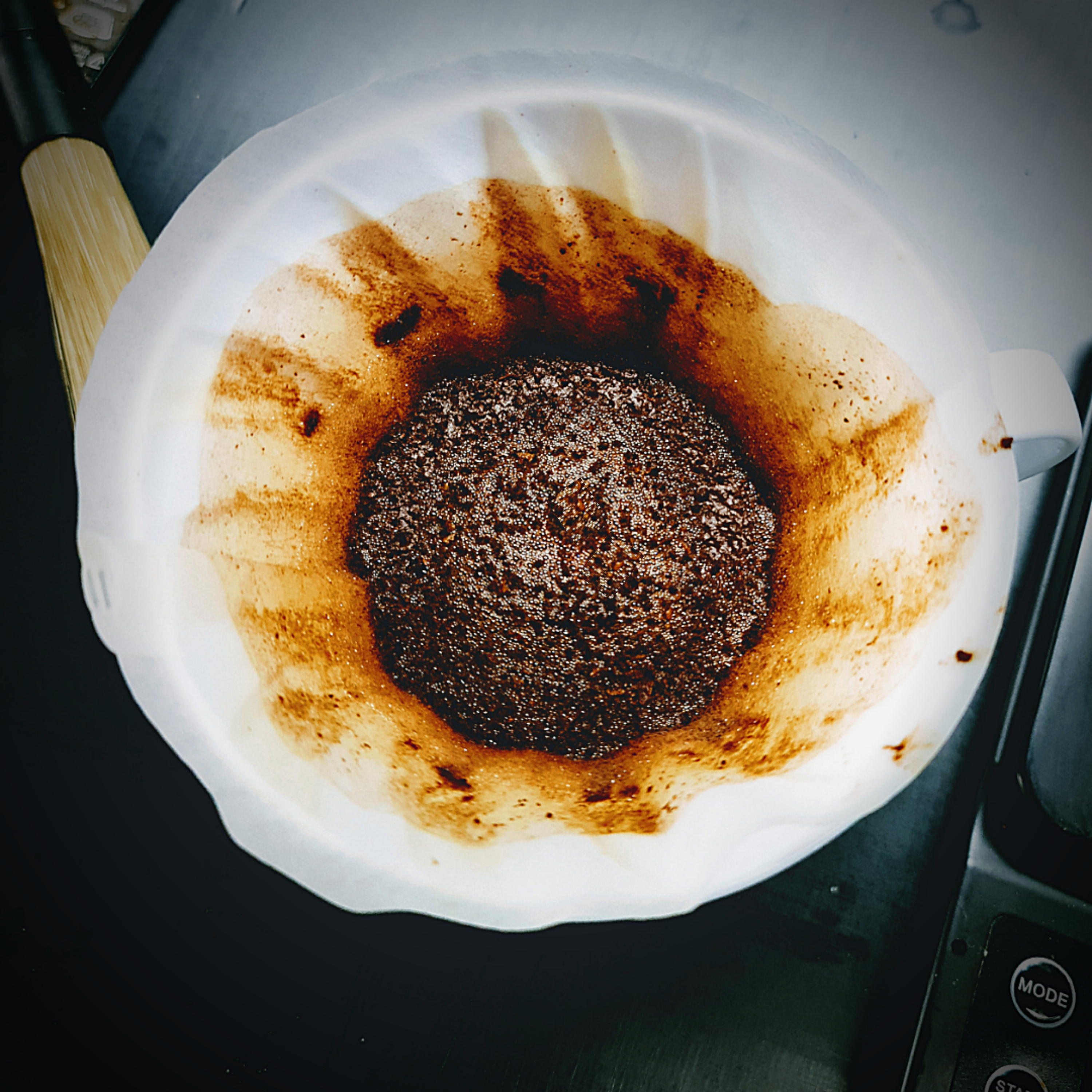 Completed V60 Pour Over Coffee in Filter paper with flat coffee bed